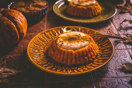 Pumpkin mini pie, tartlet made for Thanksgiving day on old wooden background. Healthy autumn food conceptの写真素材