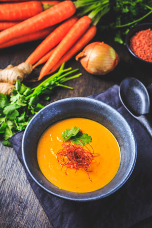 Roasted pumpkin and carrot soup with  red lentils, ginger and chiliの写真素材