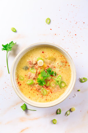 Delicious homemade leek soup with minced meat and chili on marble  backgroundの写真素材