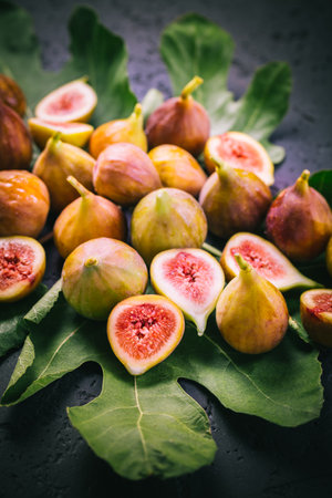 Harvesting - tasty organic figs on black backgroundの写真素材