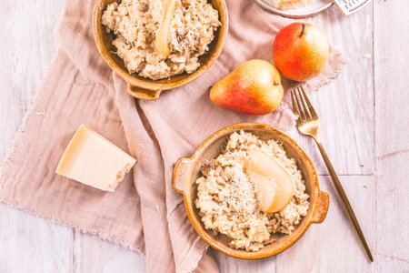 Homemade mushroom risotto with pears and  Parmesan cheeseの写真素材