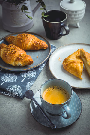Breakfast - cup of coffee, croissants and curd cheese turnover.の写真素材