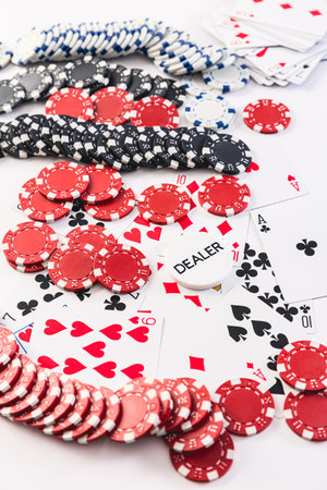 Playing cards and poker chips on white backgroundの写真素材