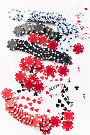 Playing cards and poker chips on white backgroundの写真素材