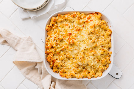 macaroni  and cheese in casserole on white kitchen tableの写真素材