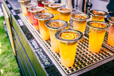 Preparing fresh ice tea at street food festival at food trucks