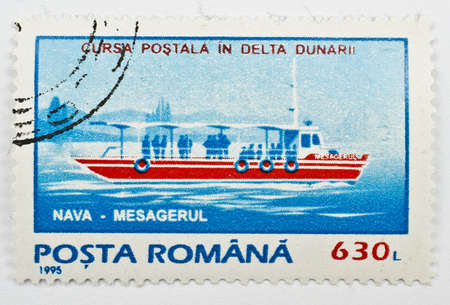  ROMANIA - CIRCA 1995  a stamp from Romania shows image of postal ship, circa 1995 の写真素材