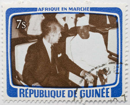  GUINEA - CIRCA 1979  a stamp from Guinea shows image of two dignitaries sitting side by side, from the Africa in Motion series, circa 1979 のeditorial素材
