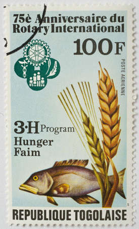  TOGO - CIRCA 1980  a stamp from Togo shows image of a fish and commemorates the food security work of Rotary International, circa 1980 のeditorial素材