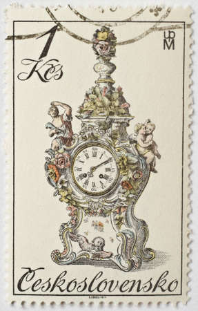  CZECHOSLOVAKIA - CIRCA 1979  a stamp from Czechoslovakia shows image of an ornate granddaughter clock, circa 1979 のeditorial素材