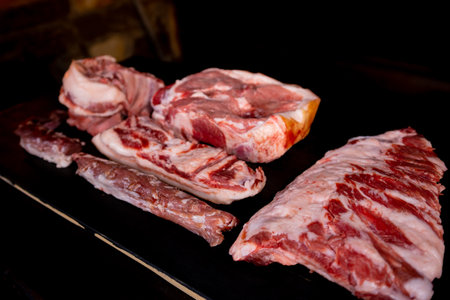 Different types of raw meat with fresh herbs.の写真素材