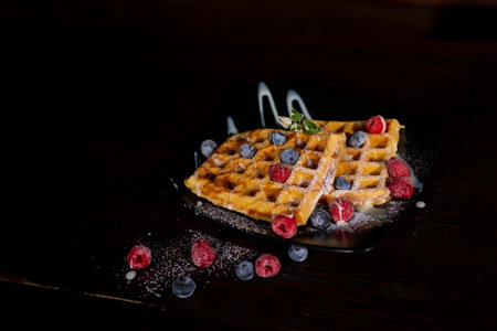 Belgian Liege waffles with berries, blueberrie Sweet breakfast dessertの写真素材