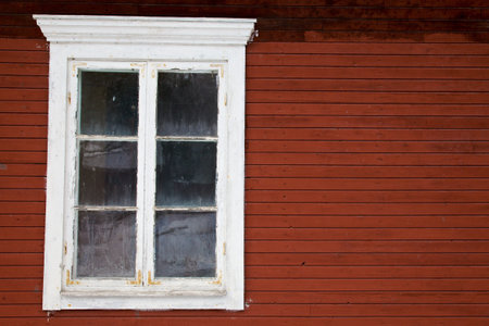 Window in red wooden wall, can be used for copy textの写真素材