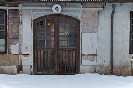 Doors of old factory building in the snowの写真素材