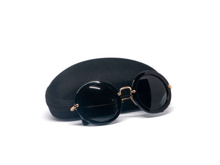 Black sunglasses with case isolated on white backgroundの写真素材