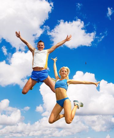 The sportsman in a jump against the skyの写真素材