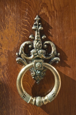 coppery wrought door knocker, bronze architecture detailの写真素材