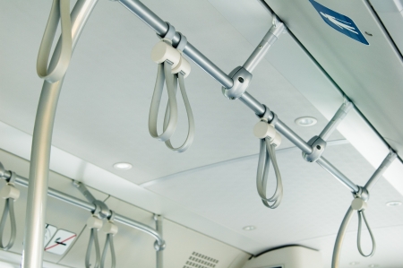 Handles for standing passenger inside a busの写真素材