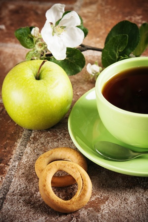 Cup of tea with an appleの写真素材