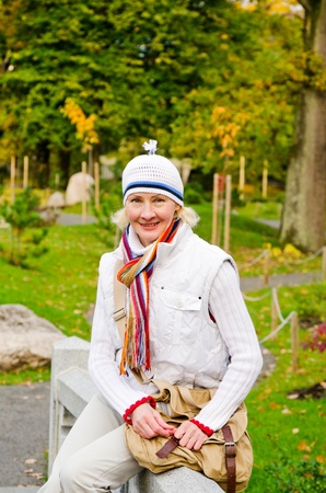 Portrait of a mature woman in the autumn  parkの写真素材