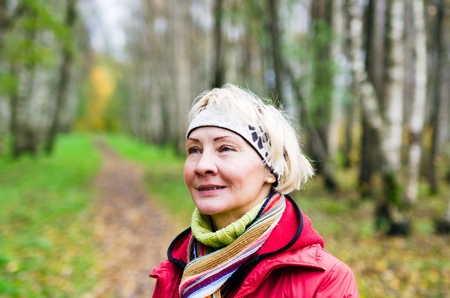 Portrait of a mature woman in the autumn  parkの写真素材