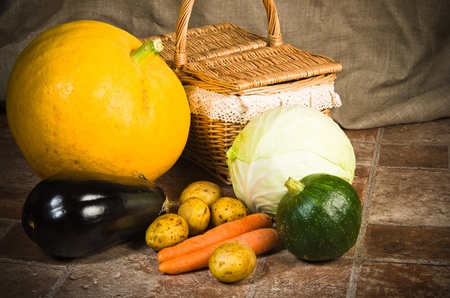 still life with vegetables and a basketの写真素材