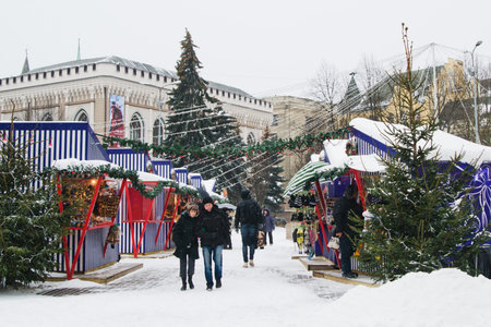 RIGA, LATVIA - DECEMBER 24  People enjoy Christmas market in RIGA on December 24, 2012 in Riga , Latvia  It is Latvia oldest Christmas Market with a very long history  のeditorial素材