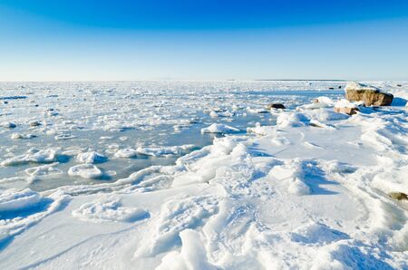 The coast of Baltic sea held down by an iceの写真素材