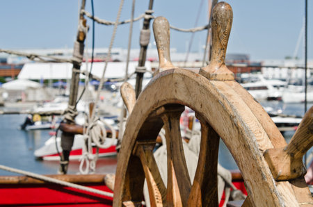 Steering wheel of an old sailing vessel, close upの写真素材