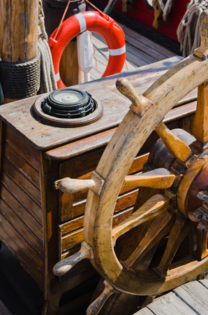Steering wheel of an old sailing vessel, close upの写真素材