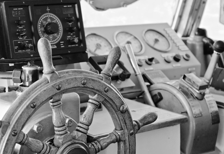 Steering wheel of an old sailing vessel, close upの写真素材