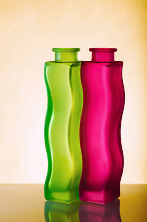 Two elegant green and red vases on a yellow background, a close upの写真素材