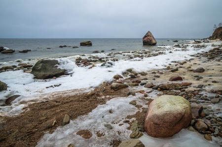 Baltic Sea coast in winter cloudy weatherの写真素材