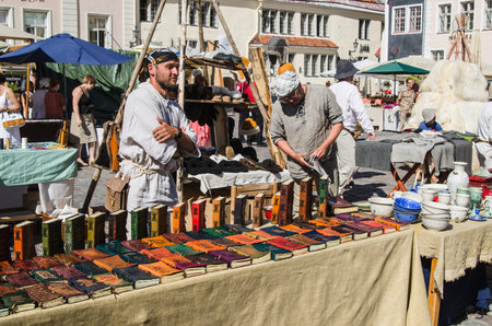 TALLINN, ESTONIA - JULY 7: Master crafts sell their products on the Medieval market In Old City On July 7, 2013 In Tallinn.のeditorial素材