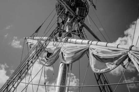 Mast with sails of an old sailing vessel, black and white photoの写真素材