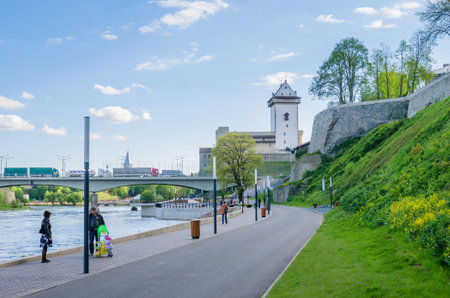 NARVA, ESTONIA - MAY 22 2015: Narva river embankment and a beautiful view of the Ivangorod Fortress and the border of Russia and the European Unionのeditorial素材