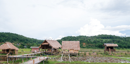 Cottage hand made from bamboo behind beautiful mountain and sky, Relaxing time in holiday at Thailand. Chiang Dao ,Chiang Mai ,Thailand.の写真素材