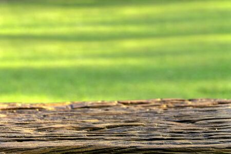 Empty wooden table over blur green background, natural scene with copyscapeの写真素材