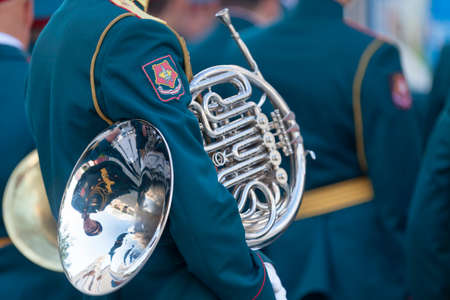 Yekaterinburg, Russia - July 15 2018: Musician from the Russian Army holding his French Horn before performing to a free outside concert.のeditorial素材