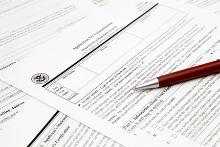 A pen on top of an application form to obtain a U.S. naturalization.