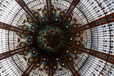 Paris, France - July 07 2017: Stained Glass of the cupola inside of the main building of the Galeries Lafayette.のeditorial素材