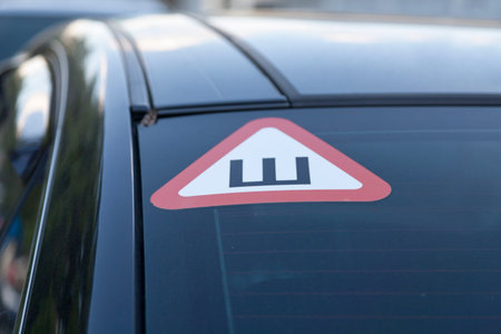 Russian 'Studded tire' Sign at the back of a car (Russian: ÐÐ½Ð°Ðº Ð¨).の写真素材