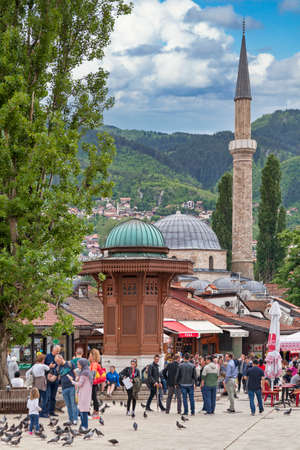 Sarajevo, Bosnia and Herzegovina - May 26 2019: The Sebilj is a Ottoman-style wooden fountain (sebil) in the centre of BaÅ¡ÄarÅ¡ija square in Sarajevo built by Mehmed Pasha Kukavica in 1753.のeditorial素材