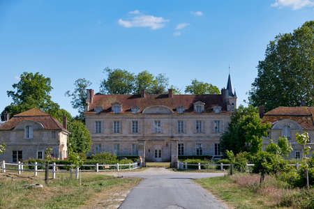 Coye-la-ForÃªt, France - March 03 2018: The Chemin des Peupliers (English: Path of the Poplars) heading to the castle with behind, the spire of the church of Notre-Dame-de-la-Jeunesse.のeditorial素材