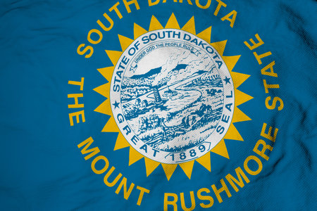 Full frame close-up on a waving flag of South Dakota (USA) in 3D rendering.