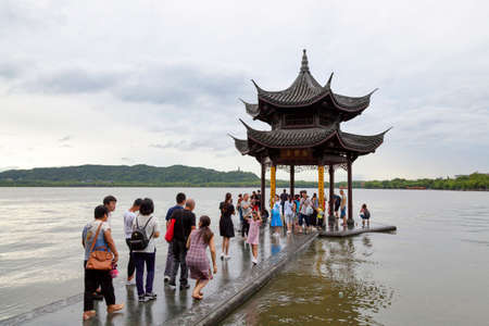 Hangzhou, China - August 13 2018: Small pavilion on the West Lake, a freshwater lake divided into five sections by three causeways.のeditorial素材