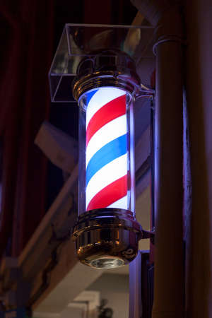 Barber's pole in a small street of Singapore.の写真素材