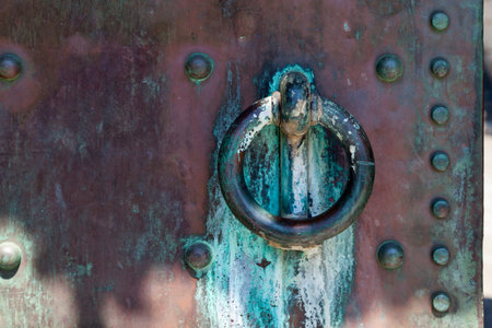 Door handle of a copper entrance door in Split, Croatia.