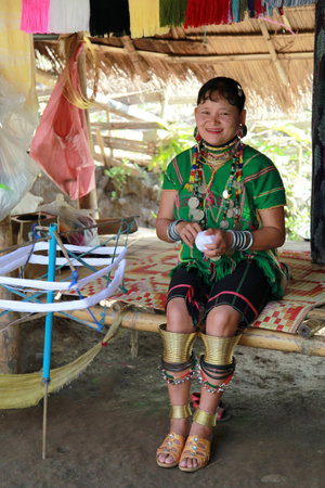 Huai Seau Tao, Thailand - August 04 2012: Smiling young woman of the Kayan Lahwi tribe.