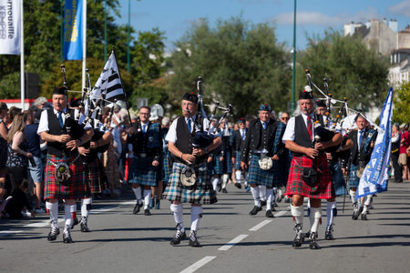 Quimper, France - July 24 2022: Musicians of the Club kilt du Pays de Lorient performing during the...